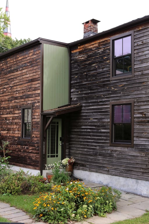 Historic wood-clad exterior of Kingston Carriage House