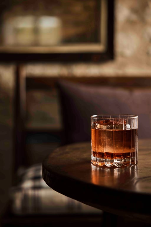 Amber cocktail in a low glass at The Fox at Oddington