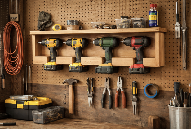 A sturdy wall-mounted shelf holding power tools in a garage