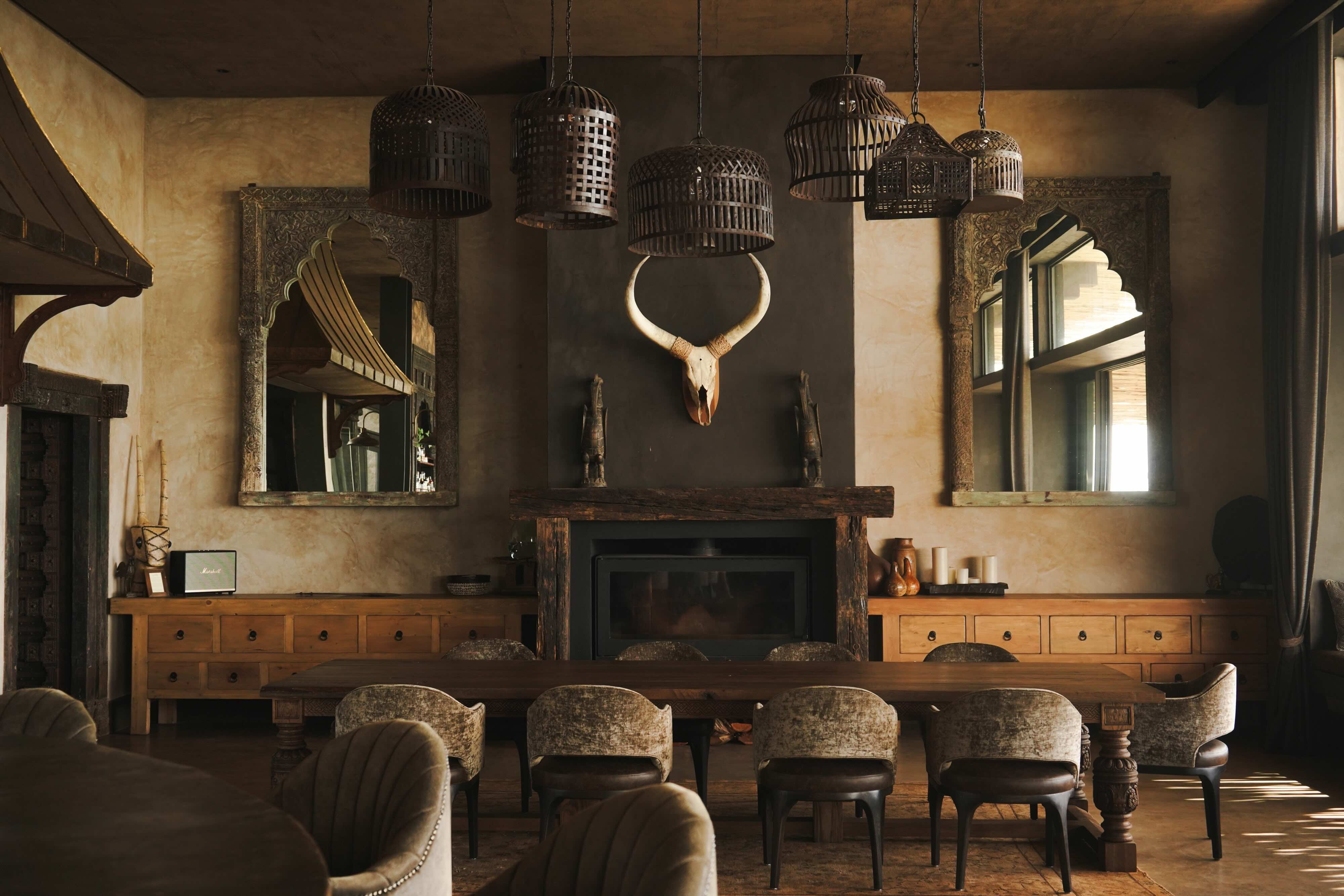 Timber furnishings and fireplace at Wild Hill
