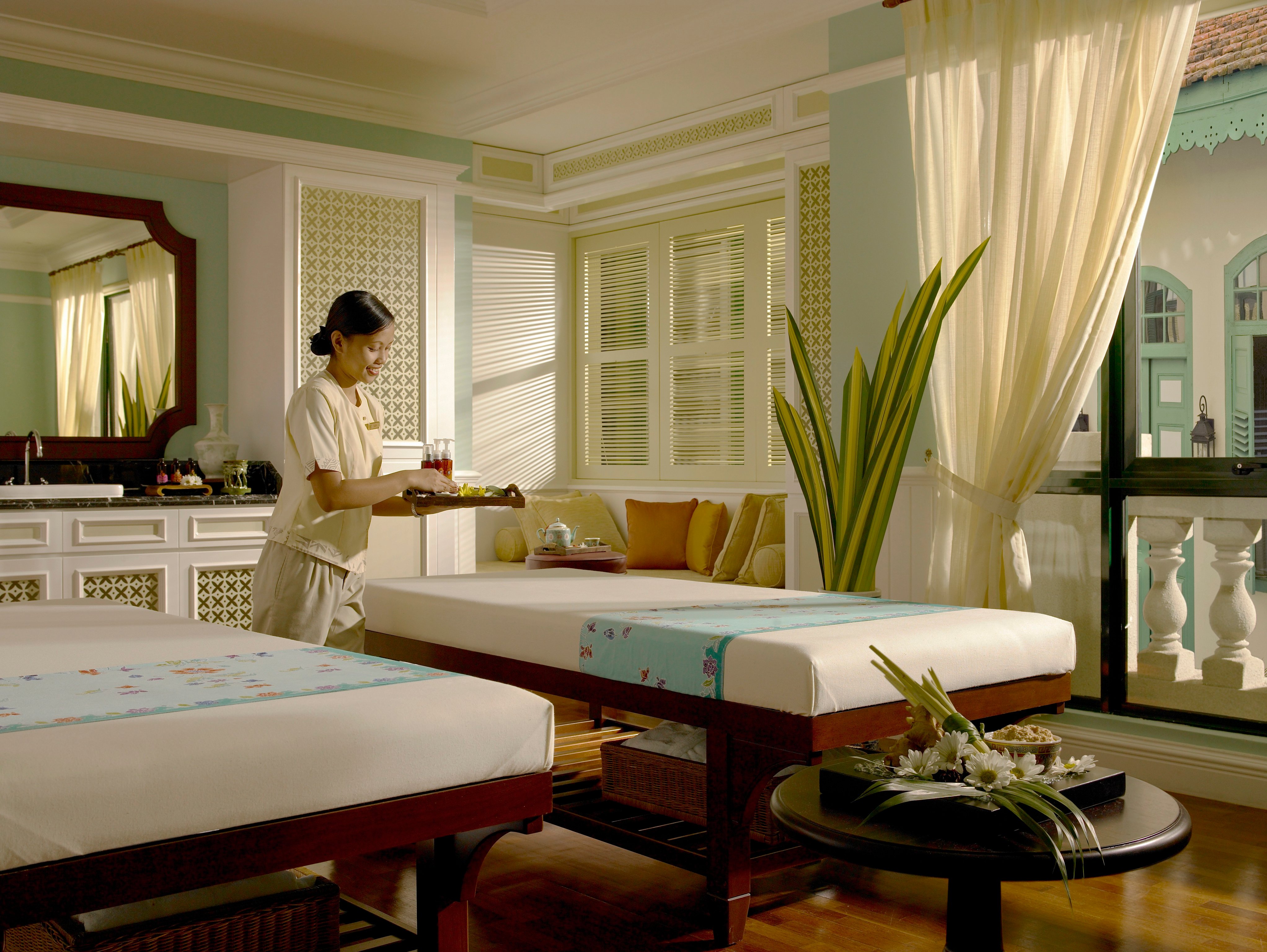 Spa treatment room with twin massage beds at The Majestic Malacca