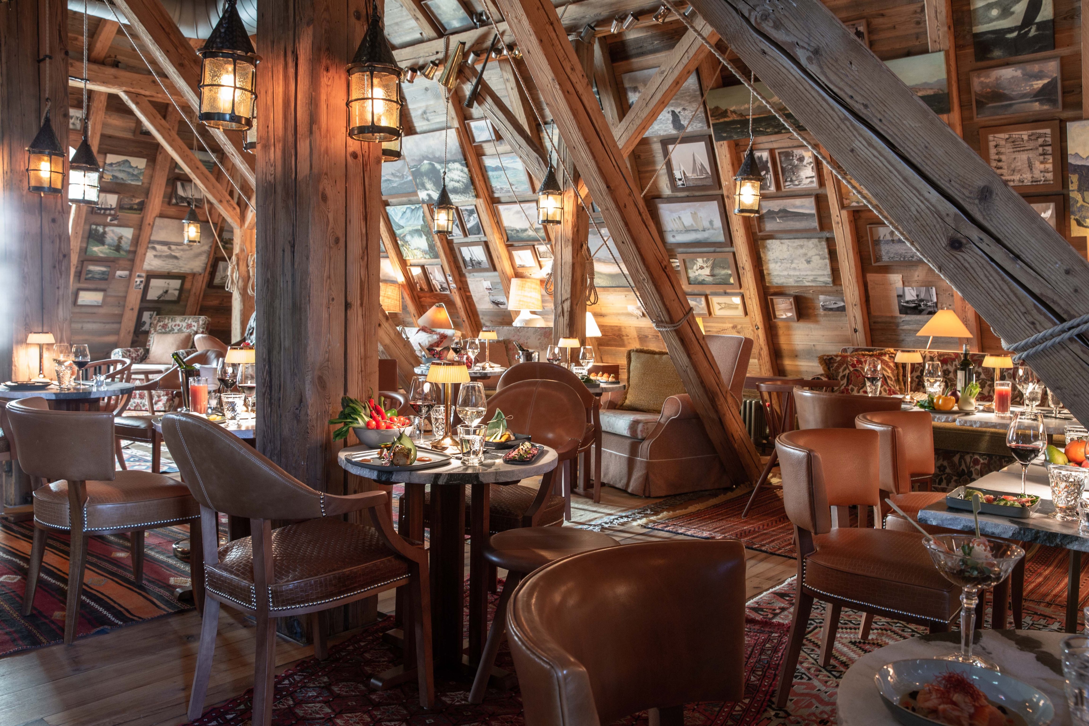 Timber rafters and dining tables at La Muña