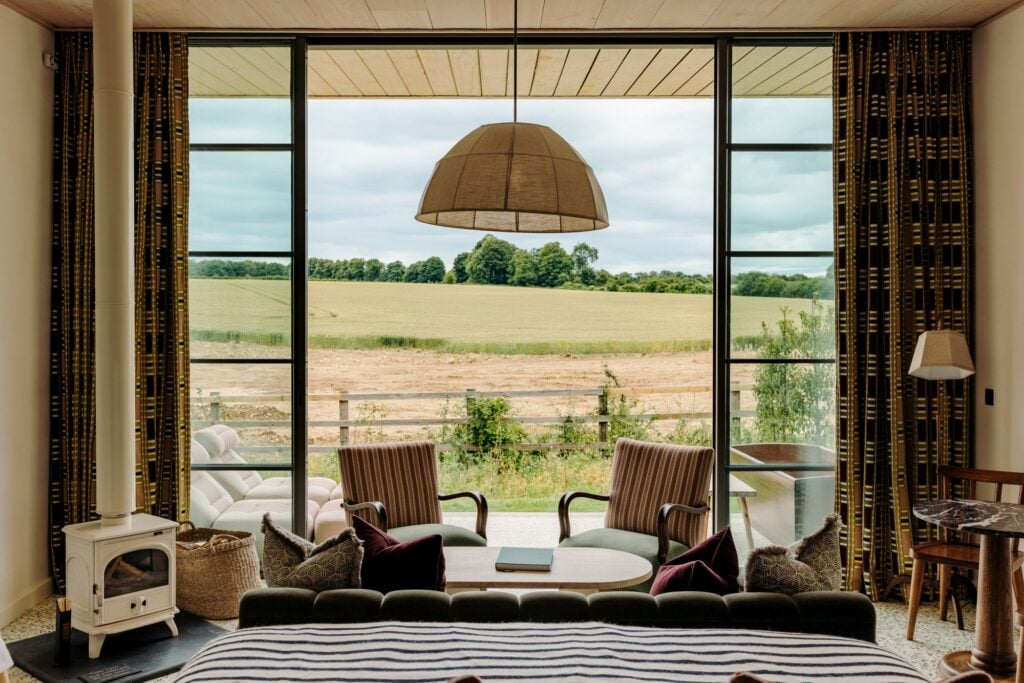 Rustic Soho Farmhouse bedroom overlooking the countryside