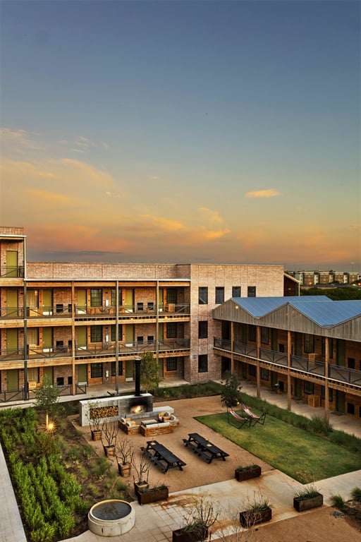 Cotton Court Hotel courtyard and fire pits at sunset