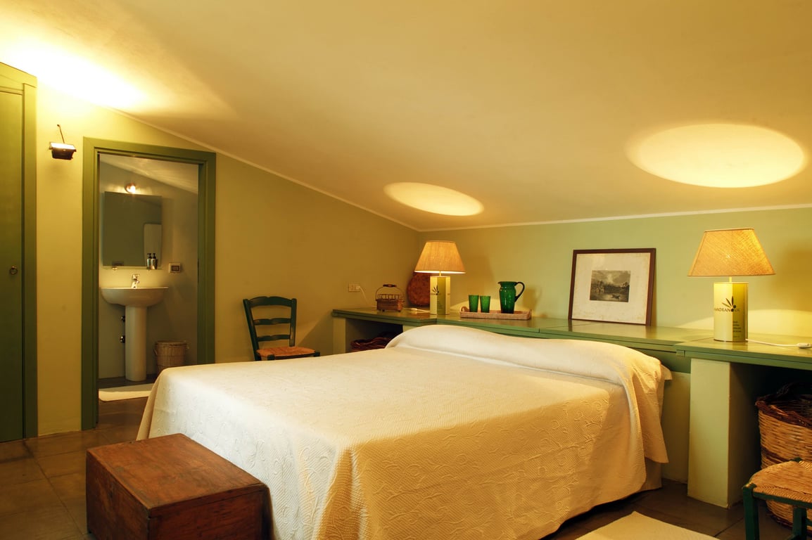 Bedroom with heirloom furniture at Azienda Agricola Mandranova