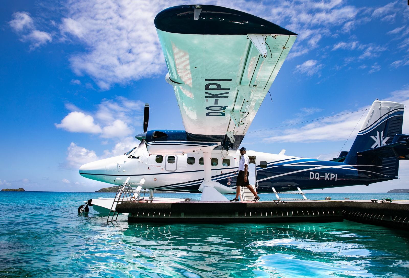 Seaplane on turquoise water beside Kokomo Private Island