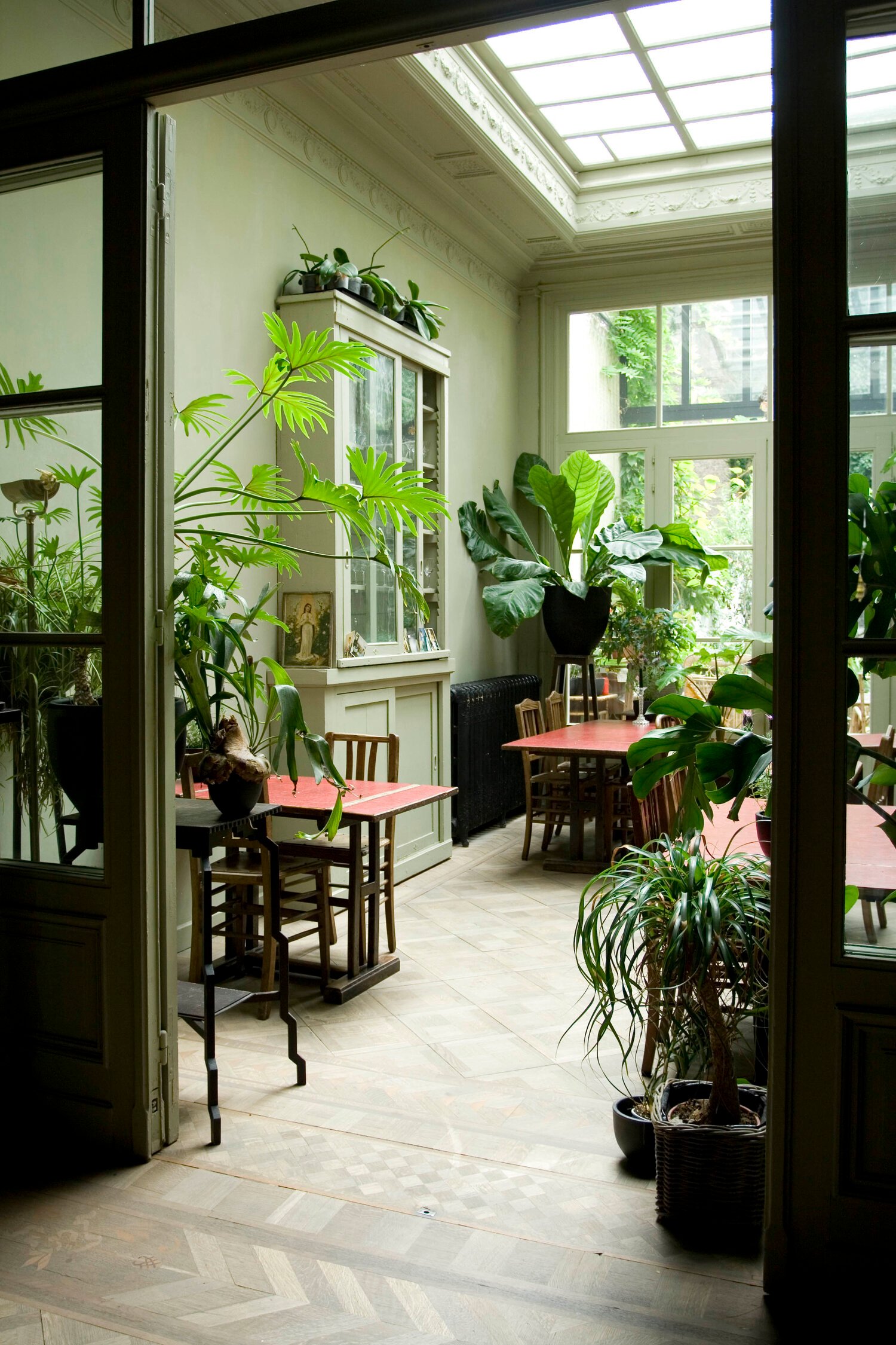 Plant-filled Orangerie at Boulevard Leopold Rooms and Suites