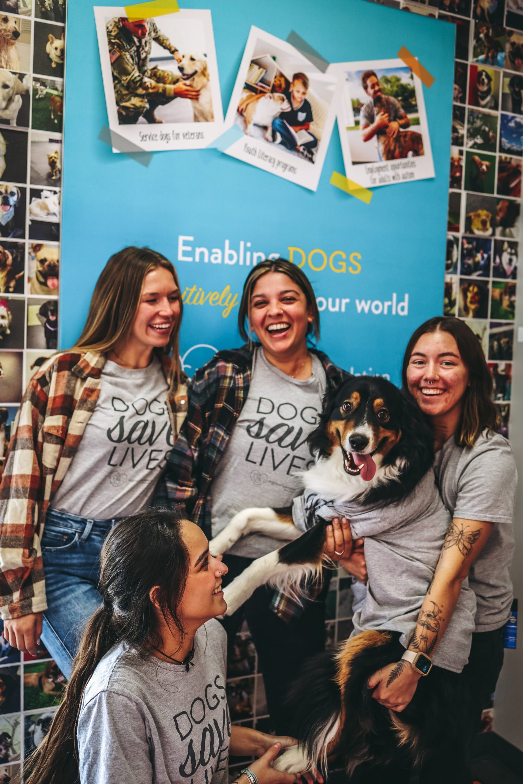 Dogtopia team members with a dog.