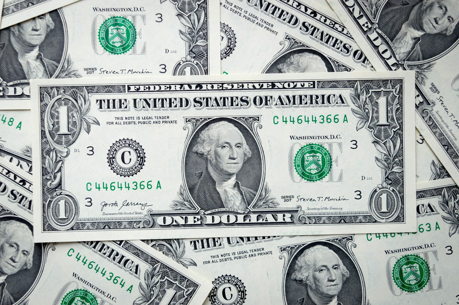 A pile of US one dollar bills