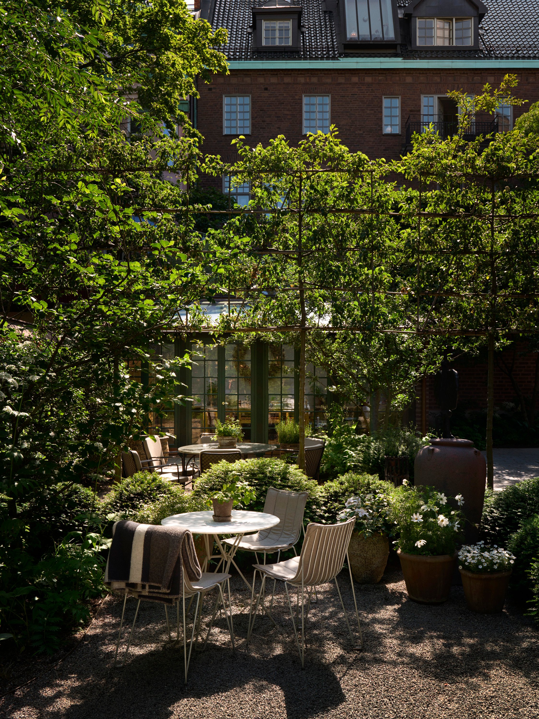 Leafy courtyard at Ett Hem in Stockholm