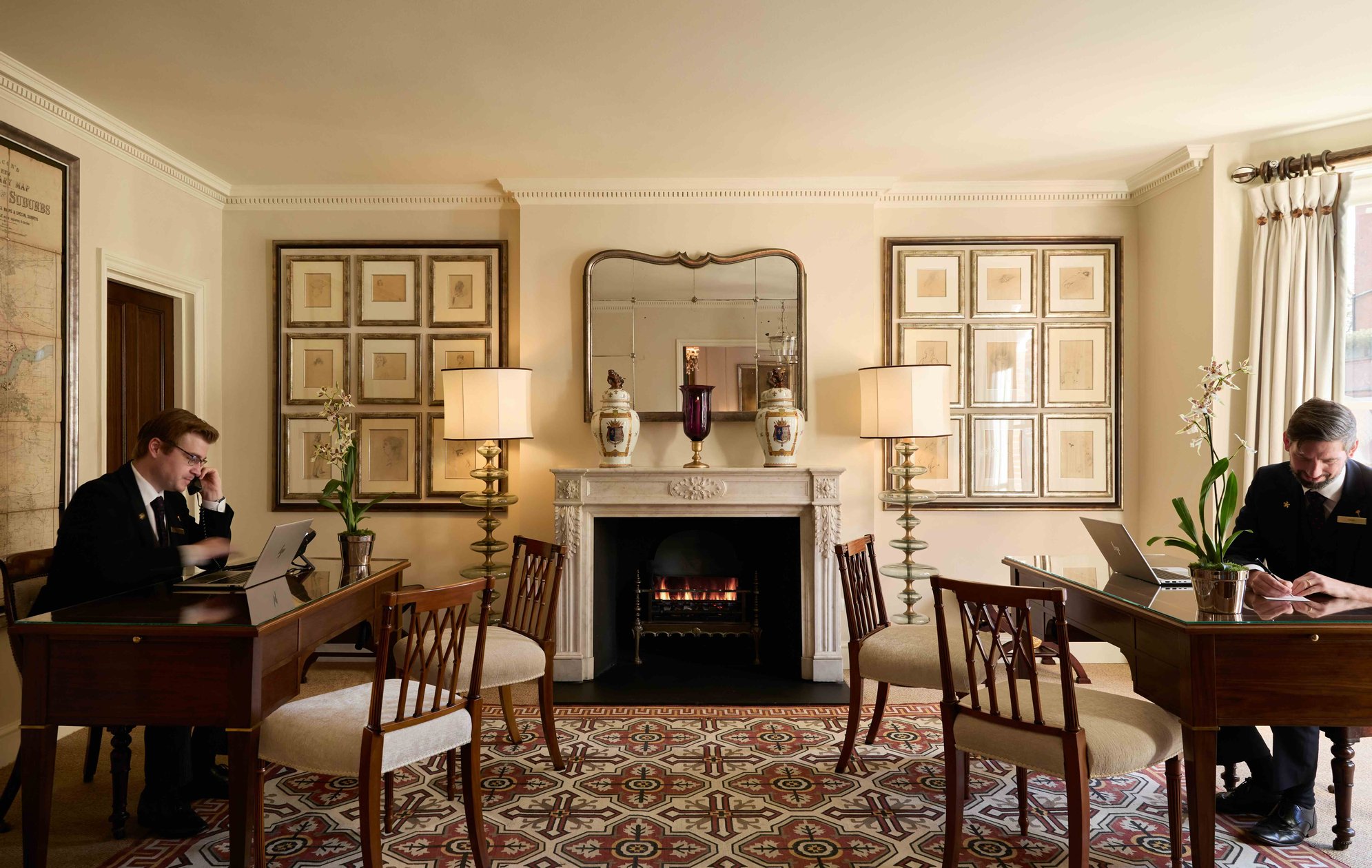 Townhouse-style reception with a fireplace at The Egerton House Hotel