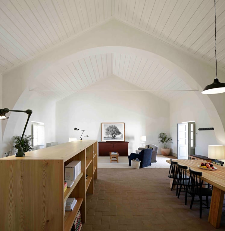 Vaulted interior with wooden furniture at São Lourenço do Barrocal