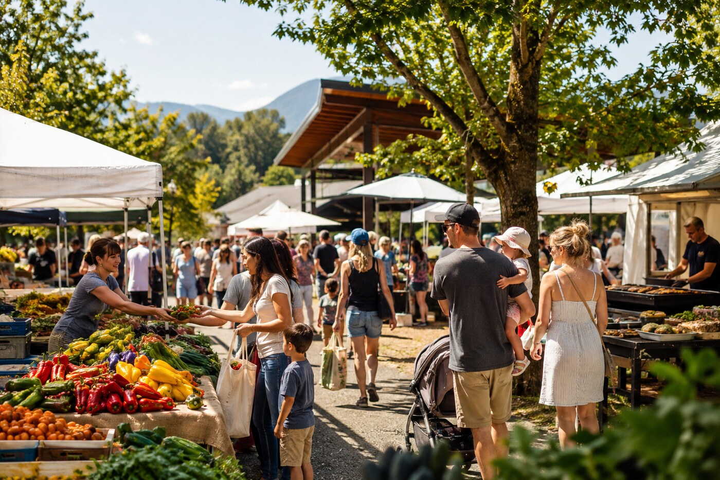 Outdoor farmers market with chilli peppers, fresh produce and shoppers in summer light