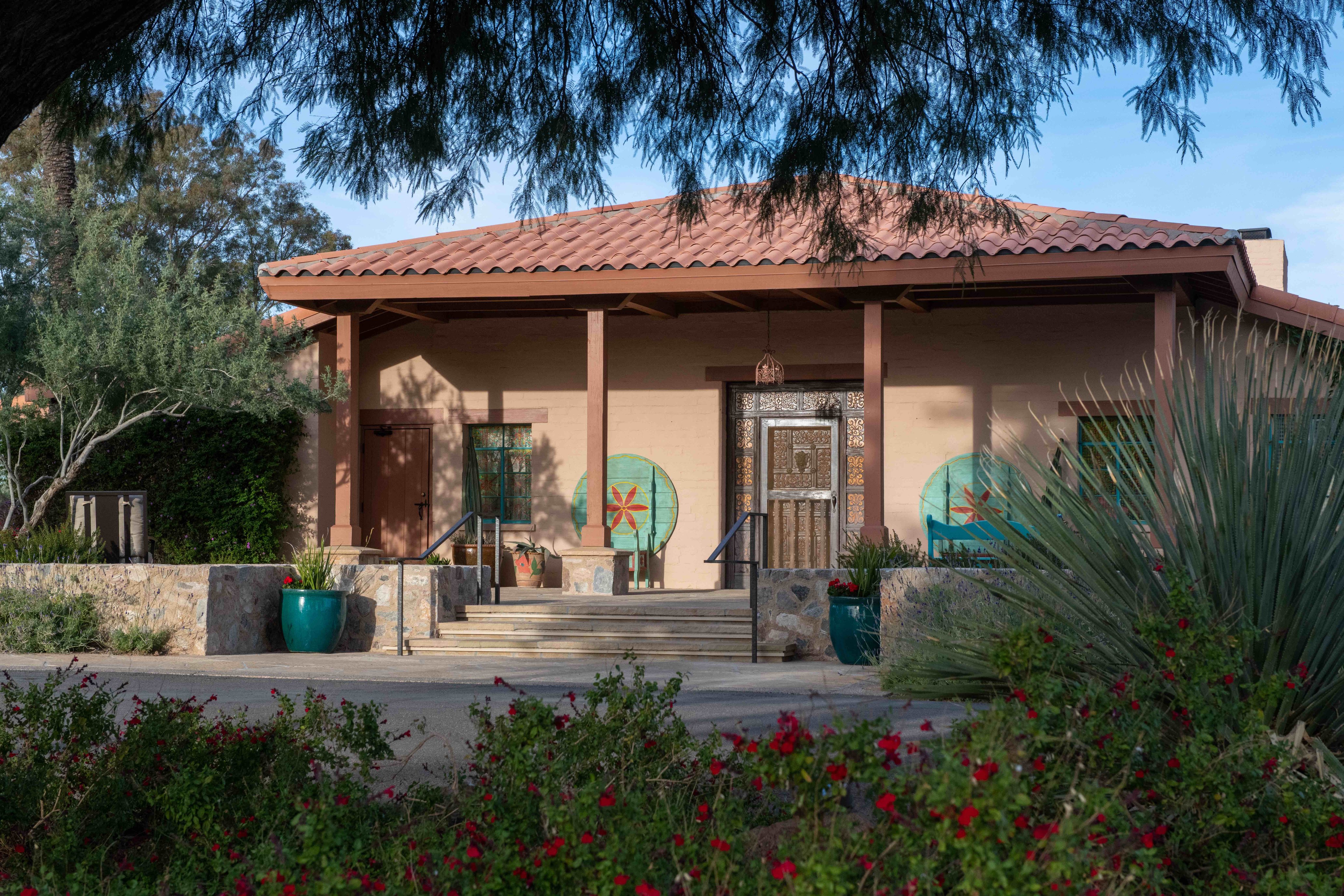 Casita exterior surrounded by gardens at Rancho de los Caballeros