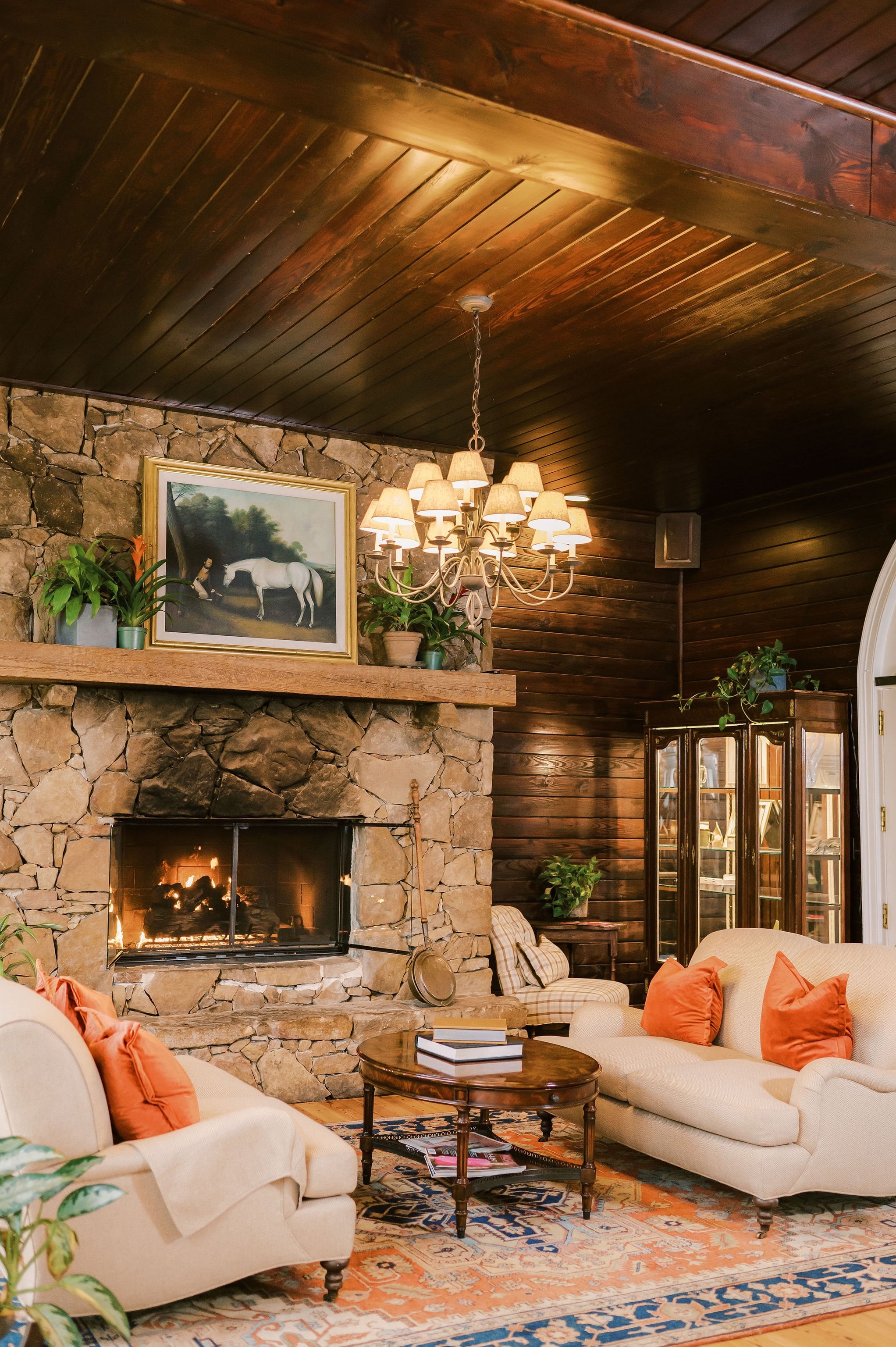 Stone fireplace and seating in Goodstone Inn’s Carriage House