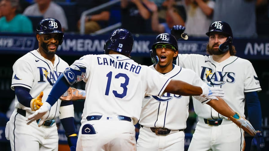 Tampa Bay Rays players celebrating home win at Tropicana Field in 2026 after returning from Hurricane Milton displacement