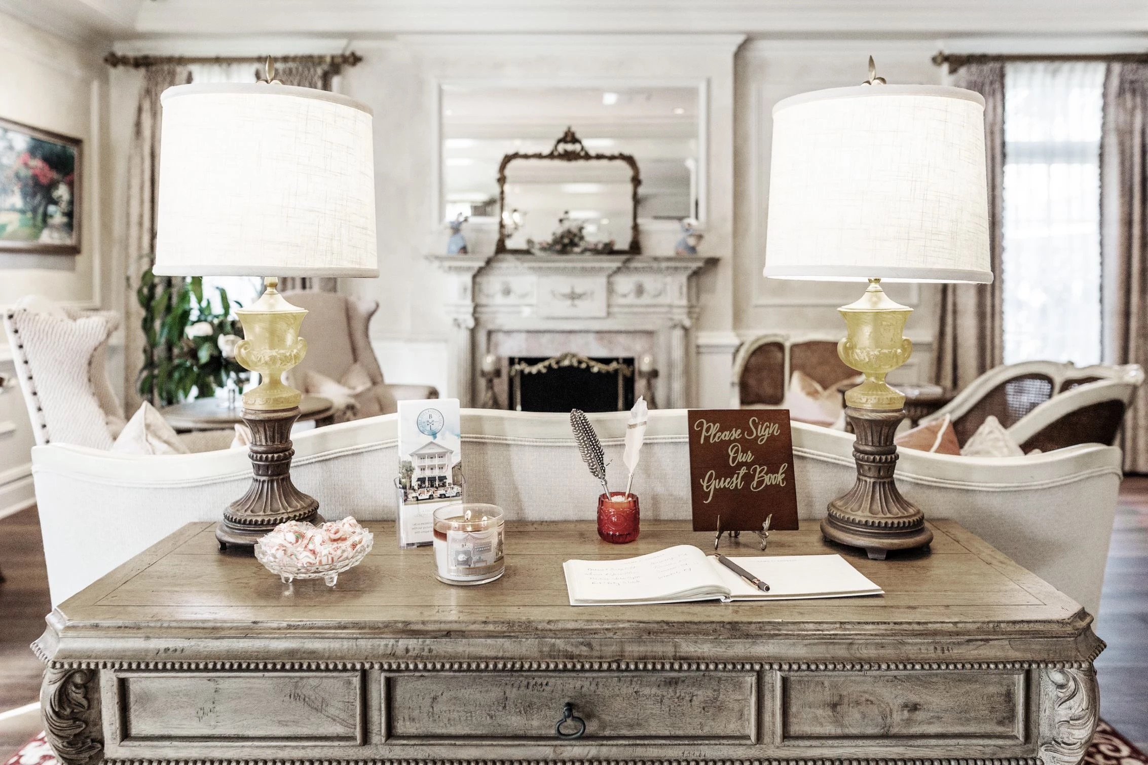 Elegant reception desk and sitting room with an ornate fireplace