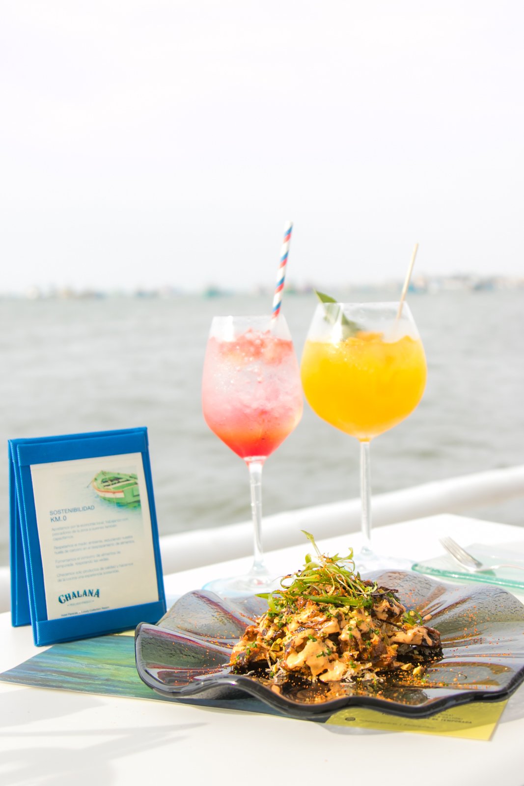 Seafood and colorful cocktails overlooking the water at Hotel Paracas