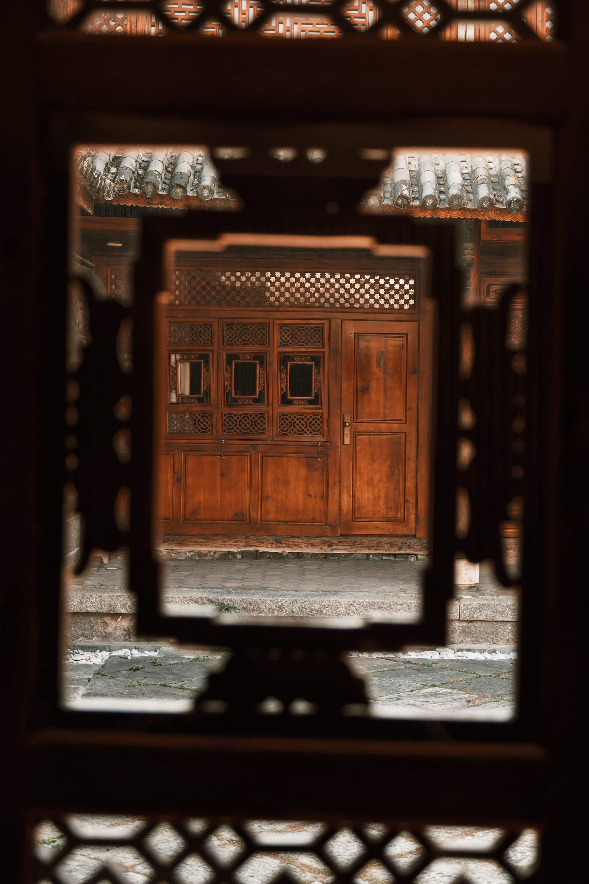 View through a carved doorway at Sky Valley Heritage Boutique Hotel