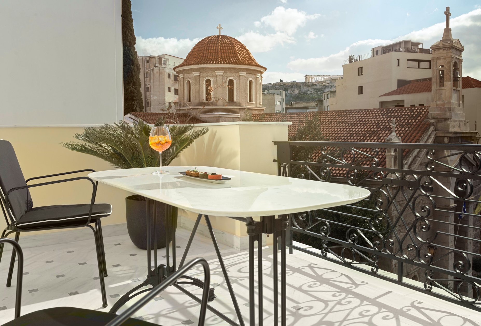 Private balcony overlooking a domed church in Athens