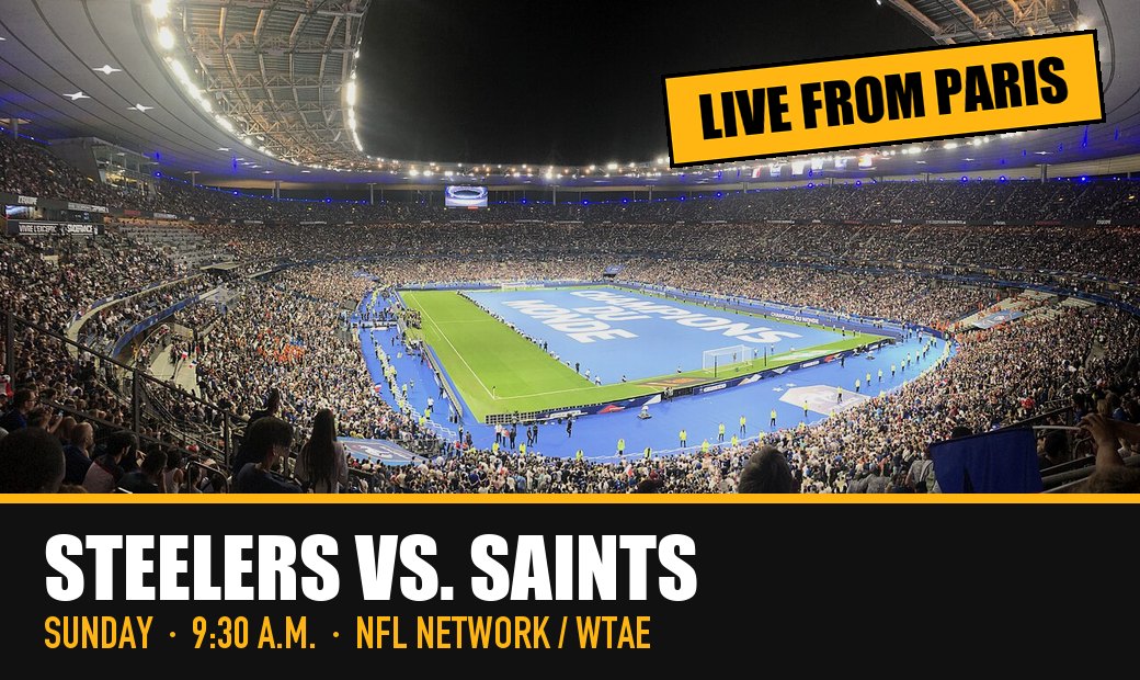 The Stade de France lit up at night and packed with fans, with a black and gold banner: Steelers vs. Saints, Sunday, 9:30 a.m., NFL Network and WTAE