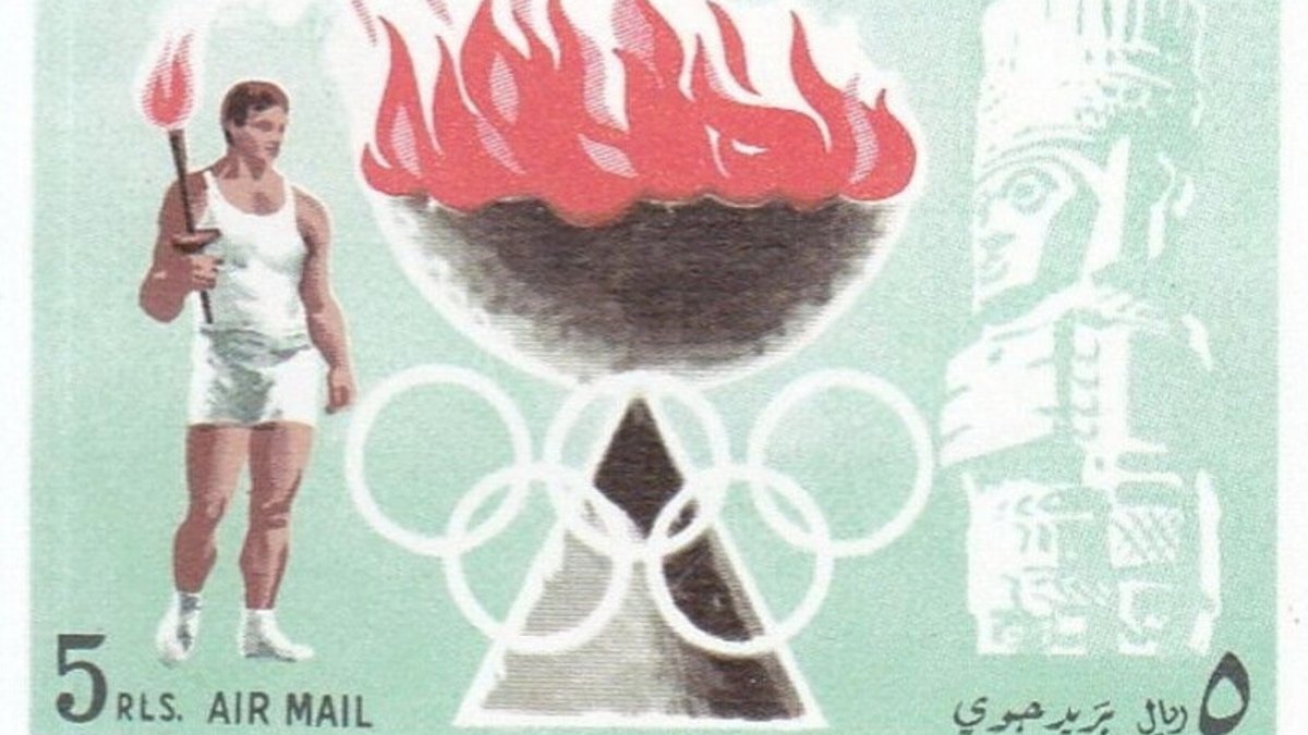 A vintage Olympic stamp showing a torch bearer beside a flaming cauldron