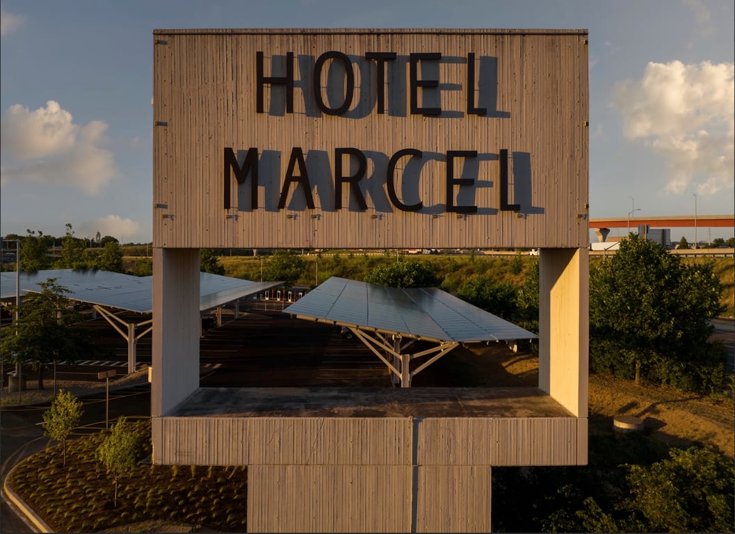 Hotel Marcel rooftop sign above solar-panel canopies