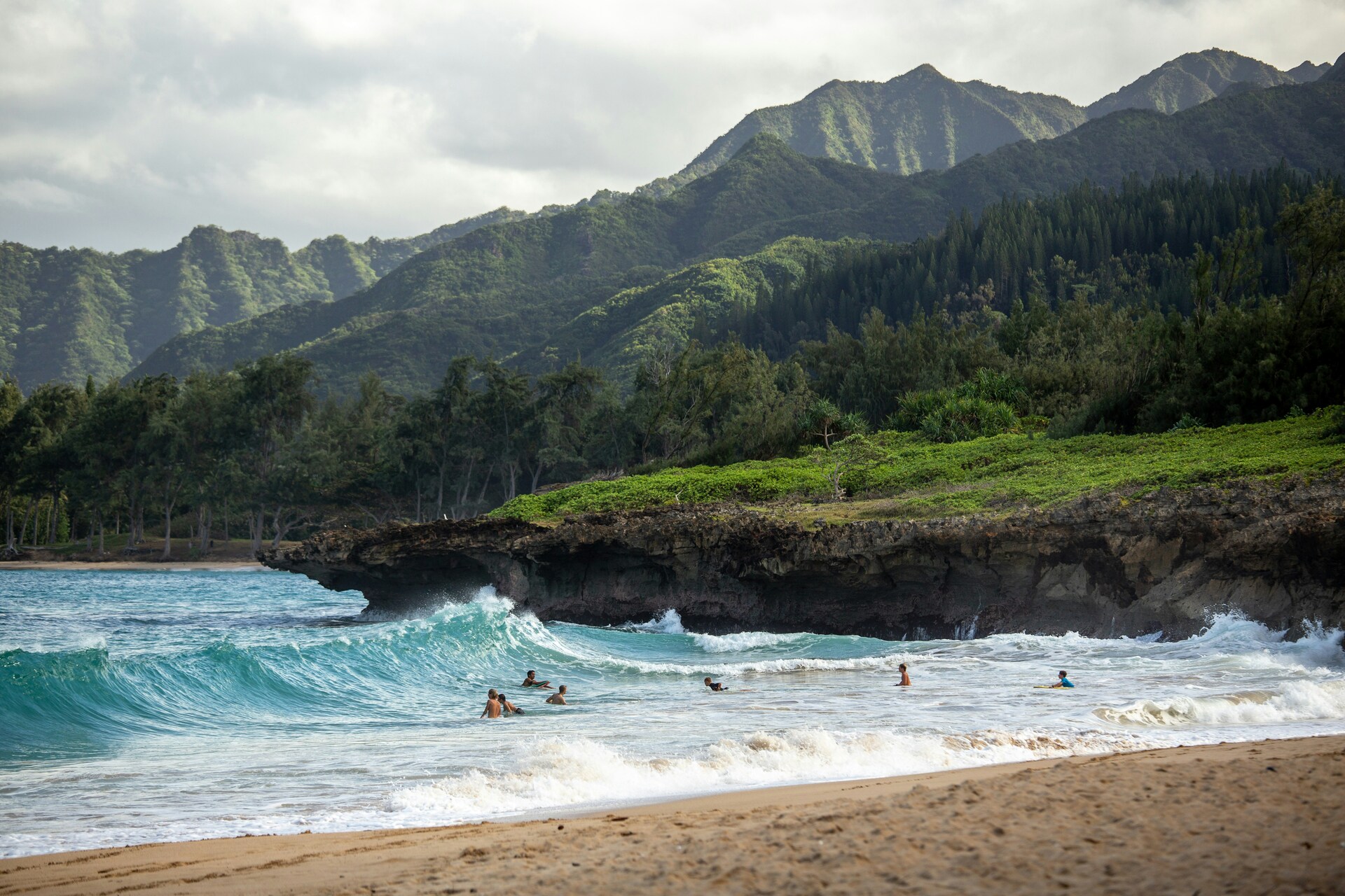 People surfing the North Shore beach of Oahu, Hawaii