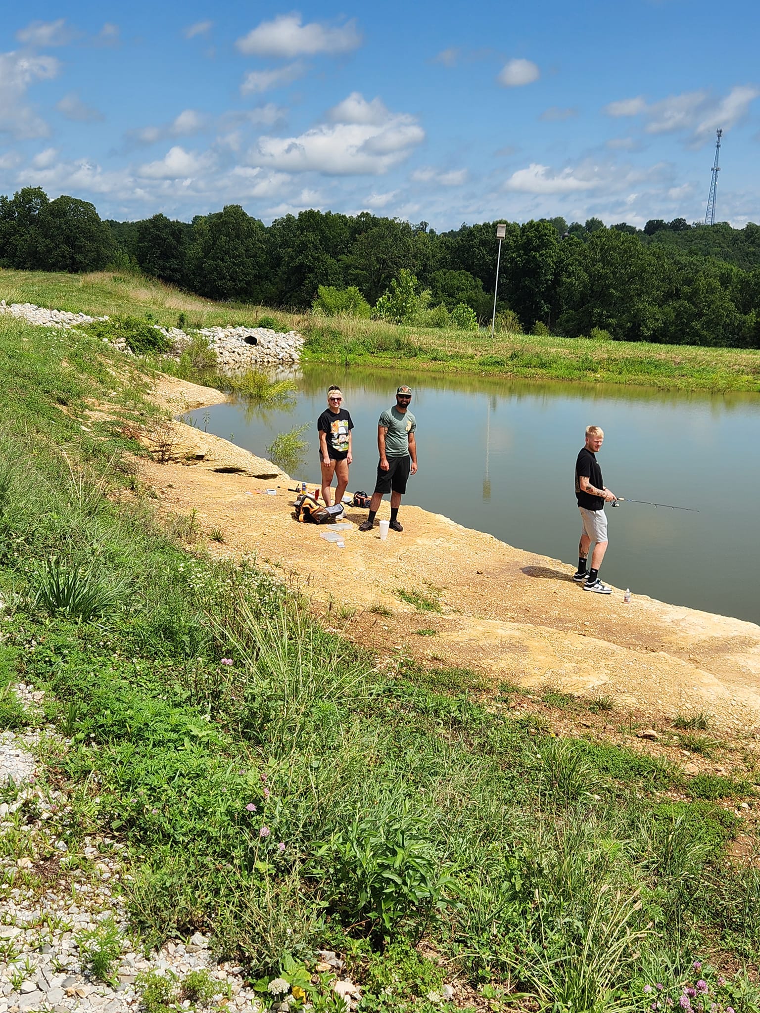 People fishing at Freddy's Pond in De Soto