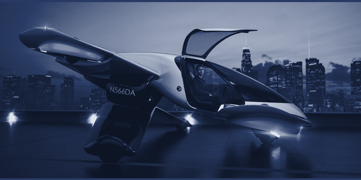 The Doroni H1-X on a rooftop pad at dusk, canopy open, pilot seated.