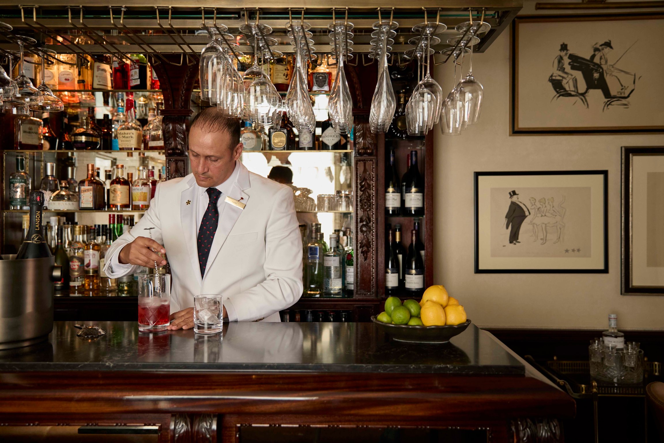 Bartender preparing a martini at The Egerton House Hotel