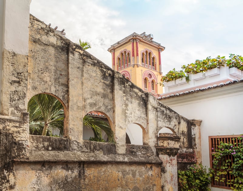 Historic aqueduct and courtyard architecture at Casa San Agustín