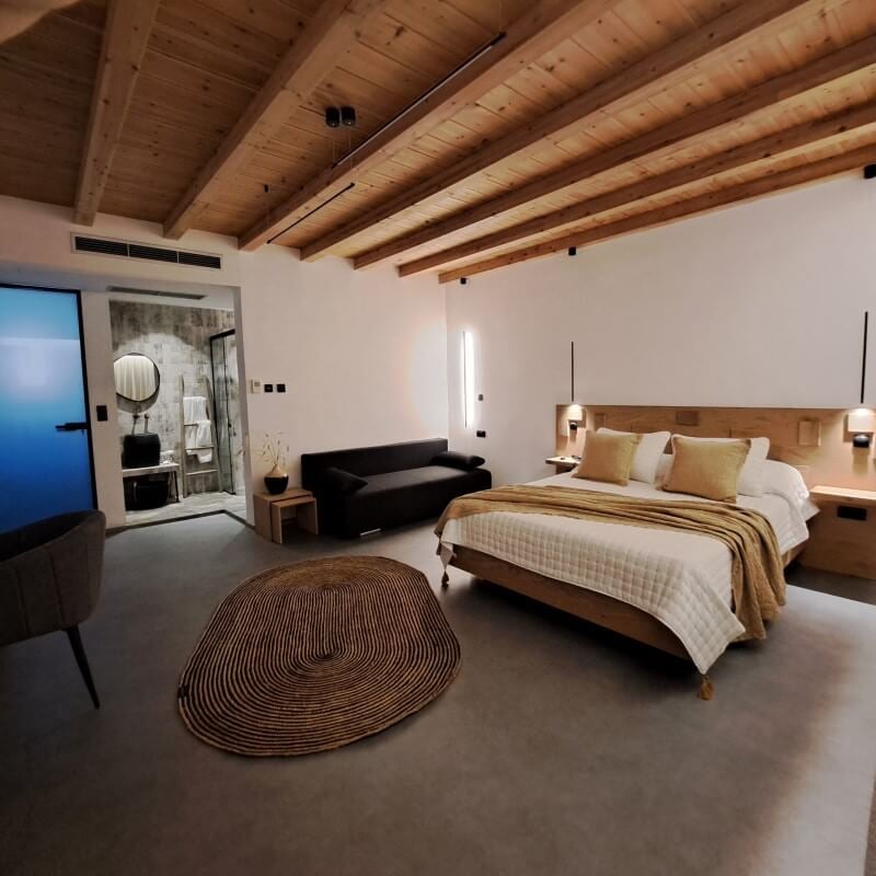 Renovated Hotel Nisaki guest room with exposed timber beams