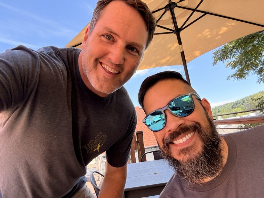 Garit with longtime friends on a sunny patio in Boone, North Carolina