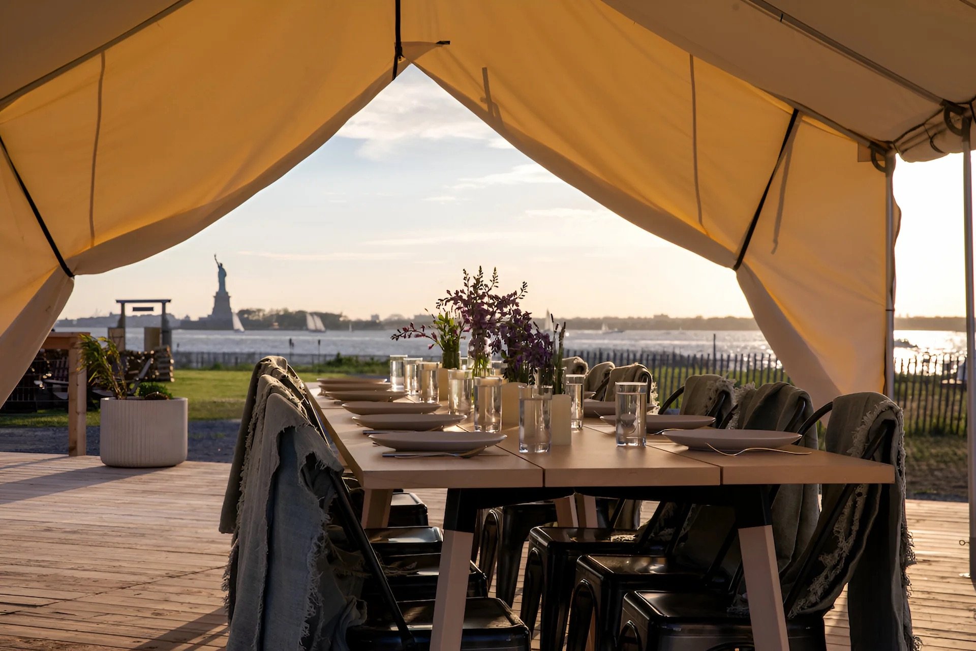 Outdoor dining with views of the Statue of Liberty