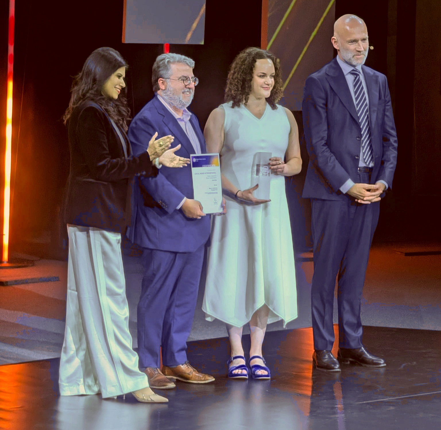 Lauren Saks and Micah Gelman accepting the WAN-IFRA award in Munich