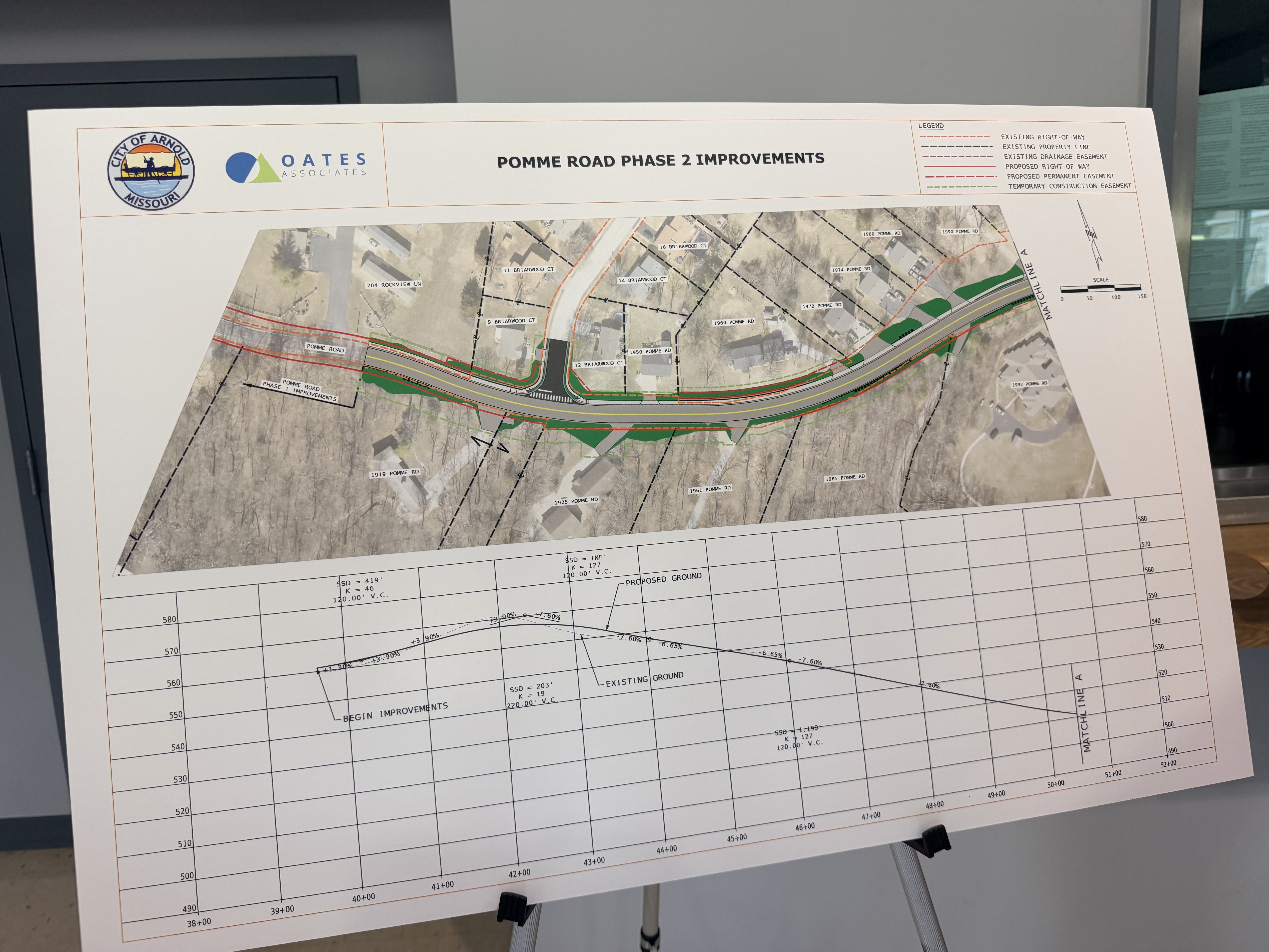 Pomme Road Phase 2 project board showing proposed changes through one of the roadway's large curves