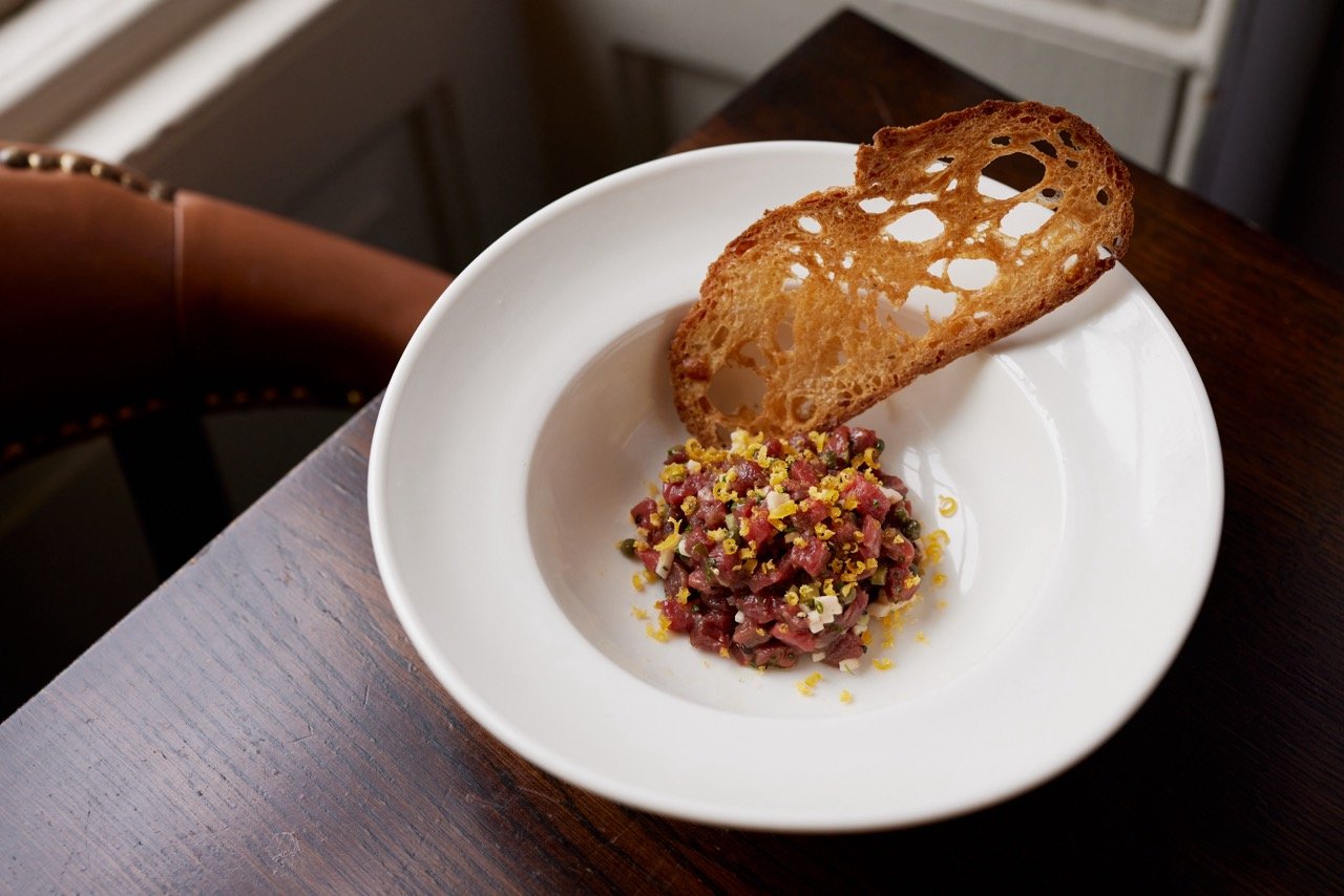 Plated dish with toasted bread at The Rectory