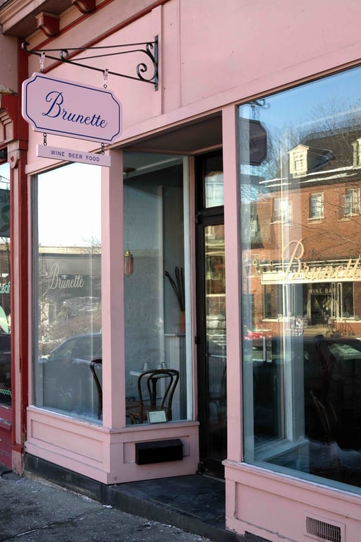 Pink storefront of Brunette wine bar in Kingston