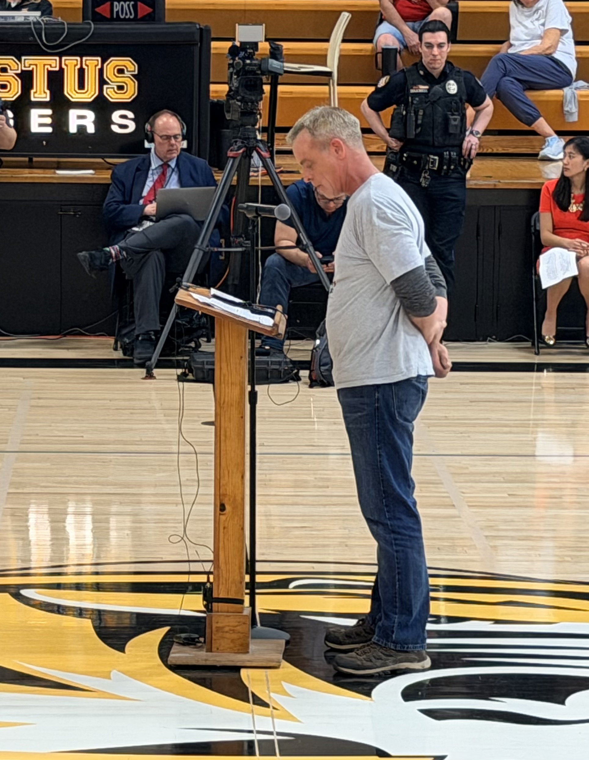 Man speaking at the podium during public comment