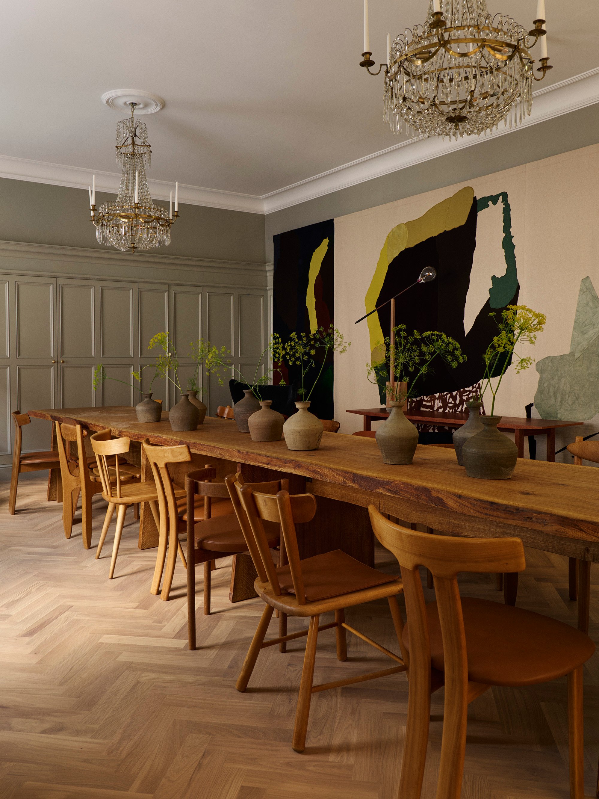 Shared dining table and contemporary artwork at Ett Hem