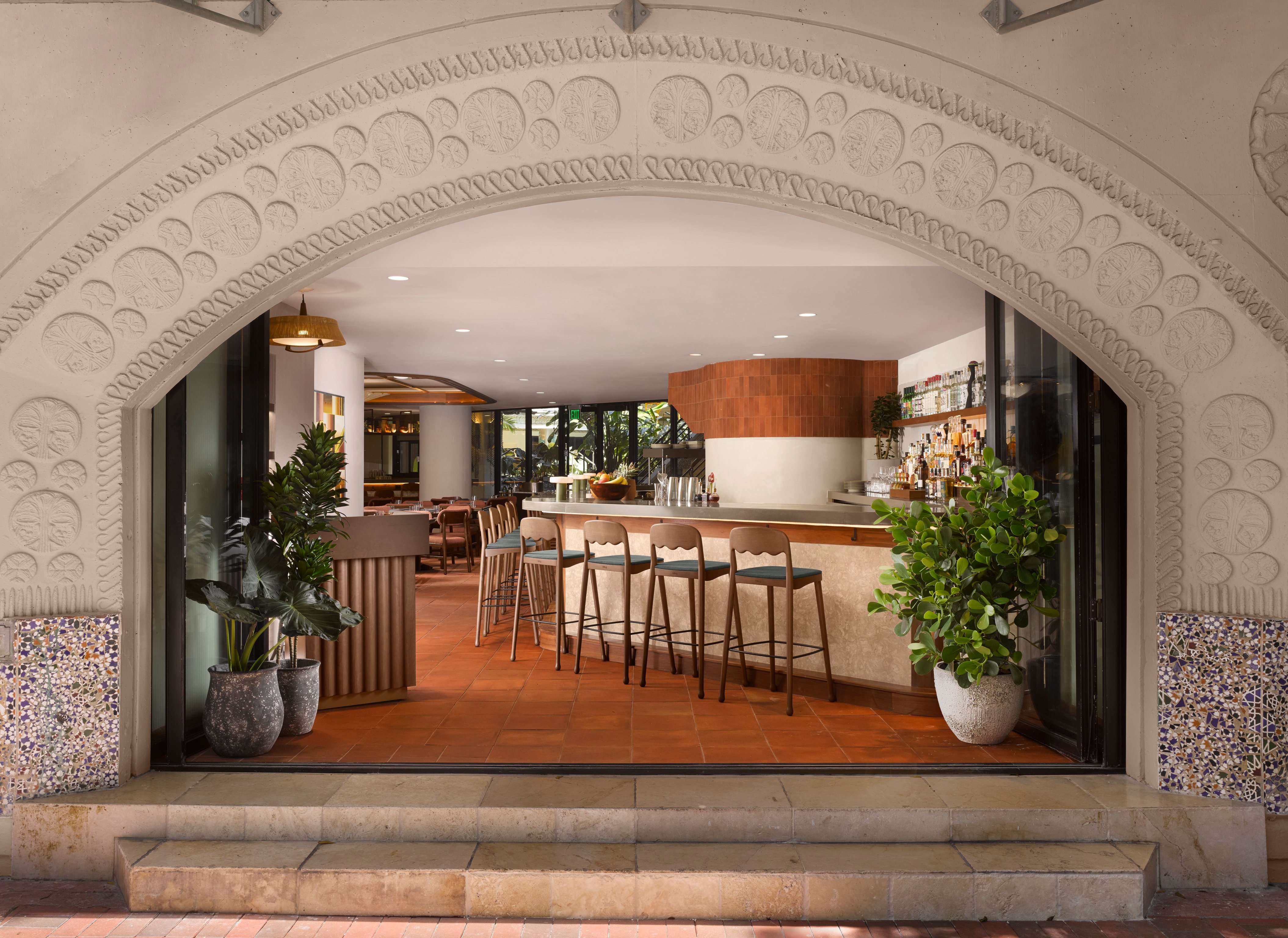 Dining room framed by an ornate arch at Mayfair House Hotel and Garden