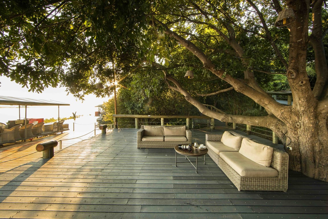 Shaded riverfront seating at Chobe Game Lodge
