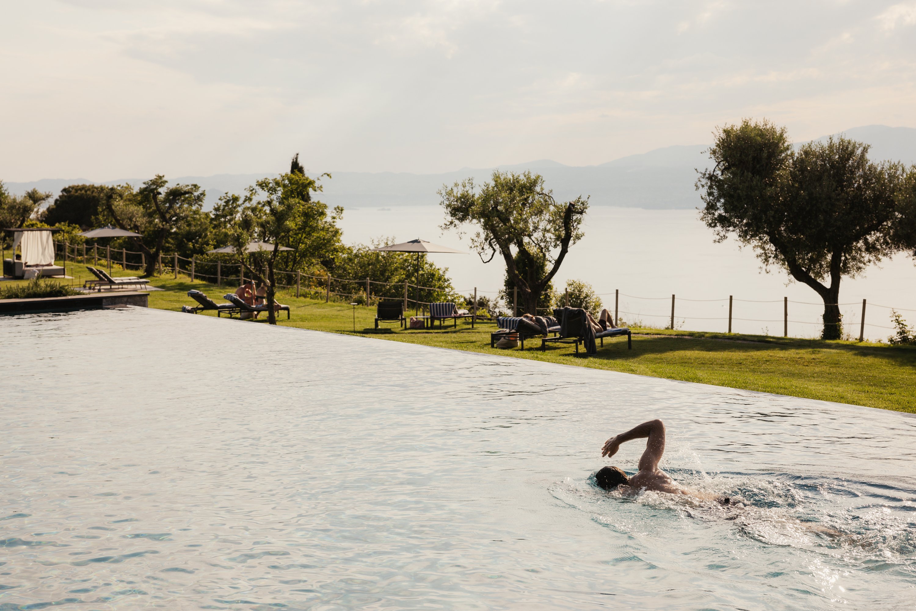 Guest swimming in the outdoor pool at Cape of Senses
