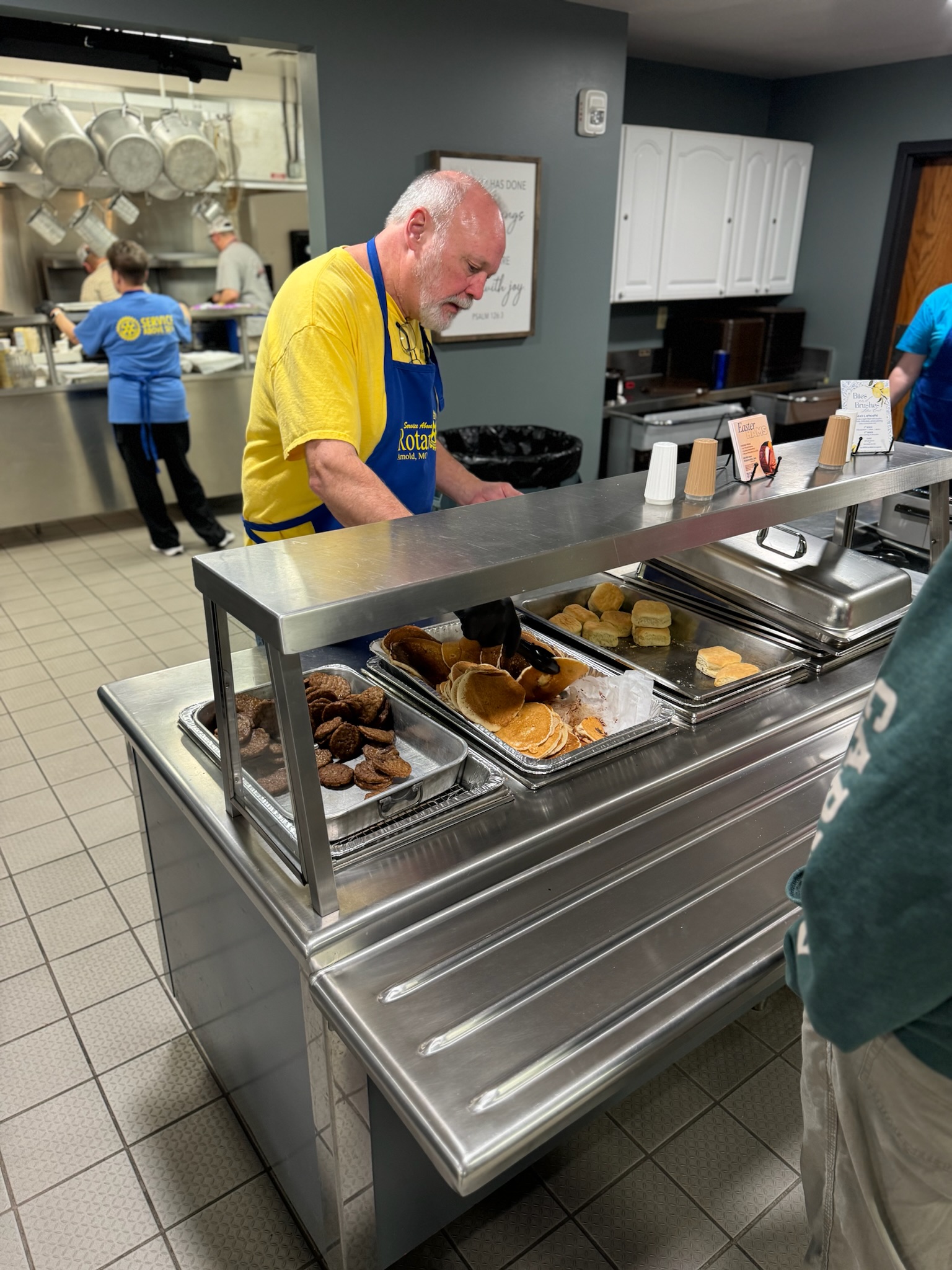 Volunteers serving breakfast