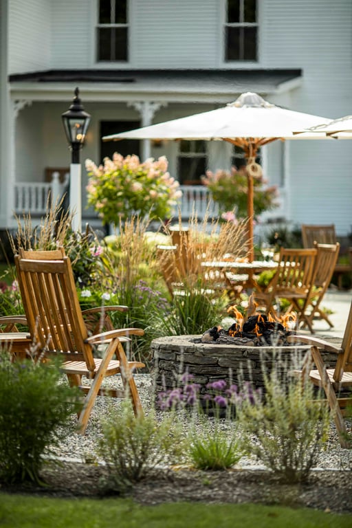 Garden terrace with outdoor tables and umbrellas at The Weston