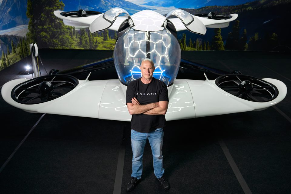 Doron Merdinger with the full-scale H1-X showroom model