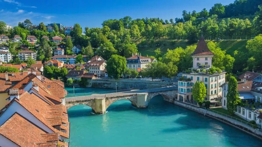 Swimmers in the clear turquoise Aare river running through Bern, Switzerland