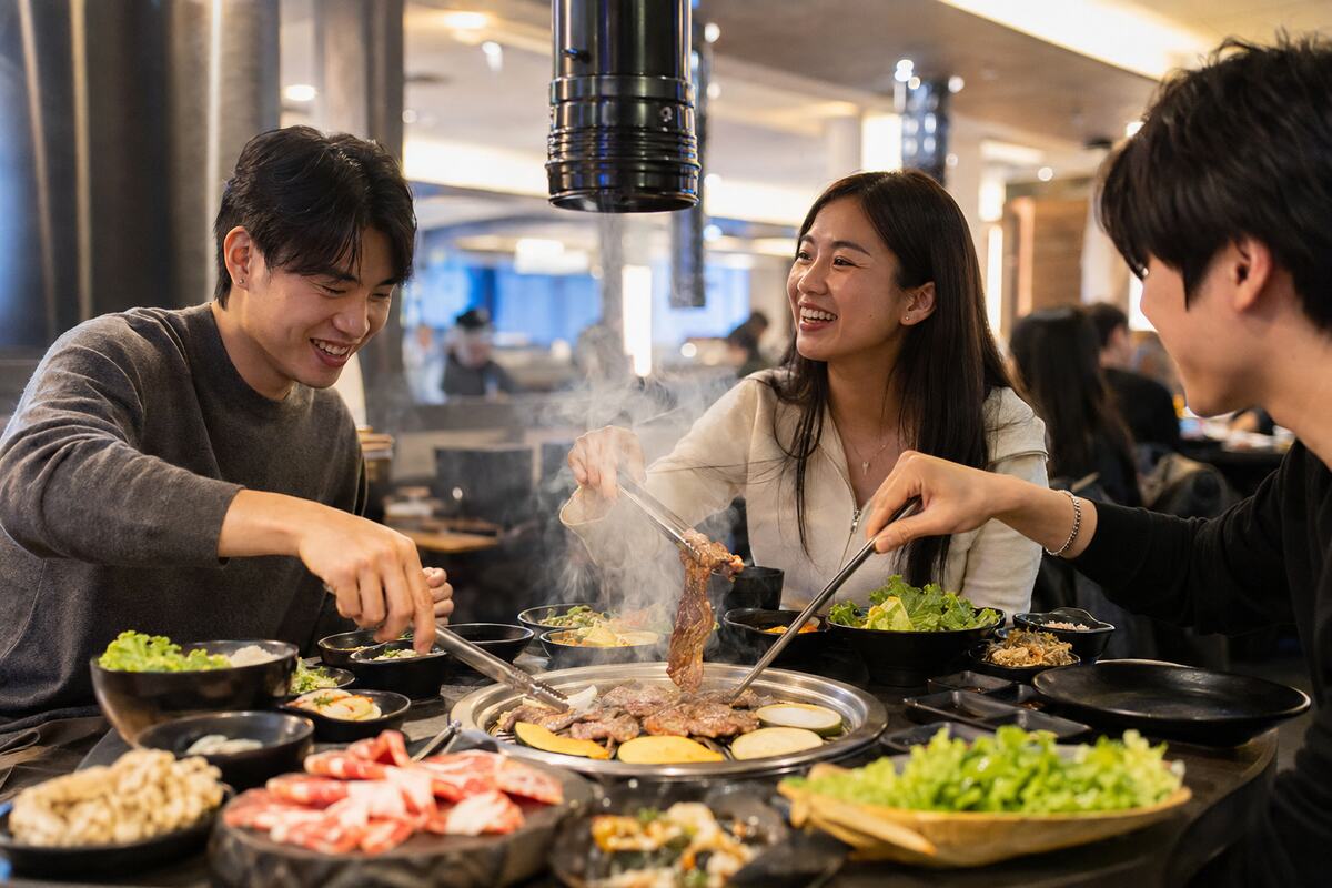 Friends grilling Japanese barbecue together at a lively Richmond restaurant