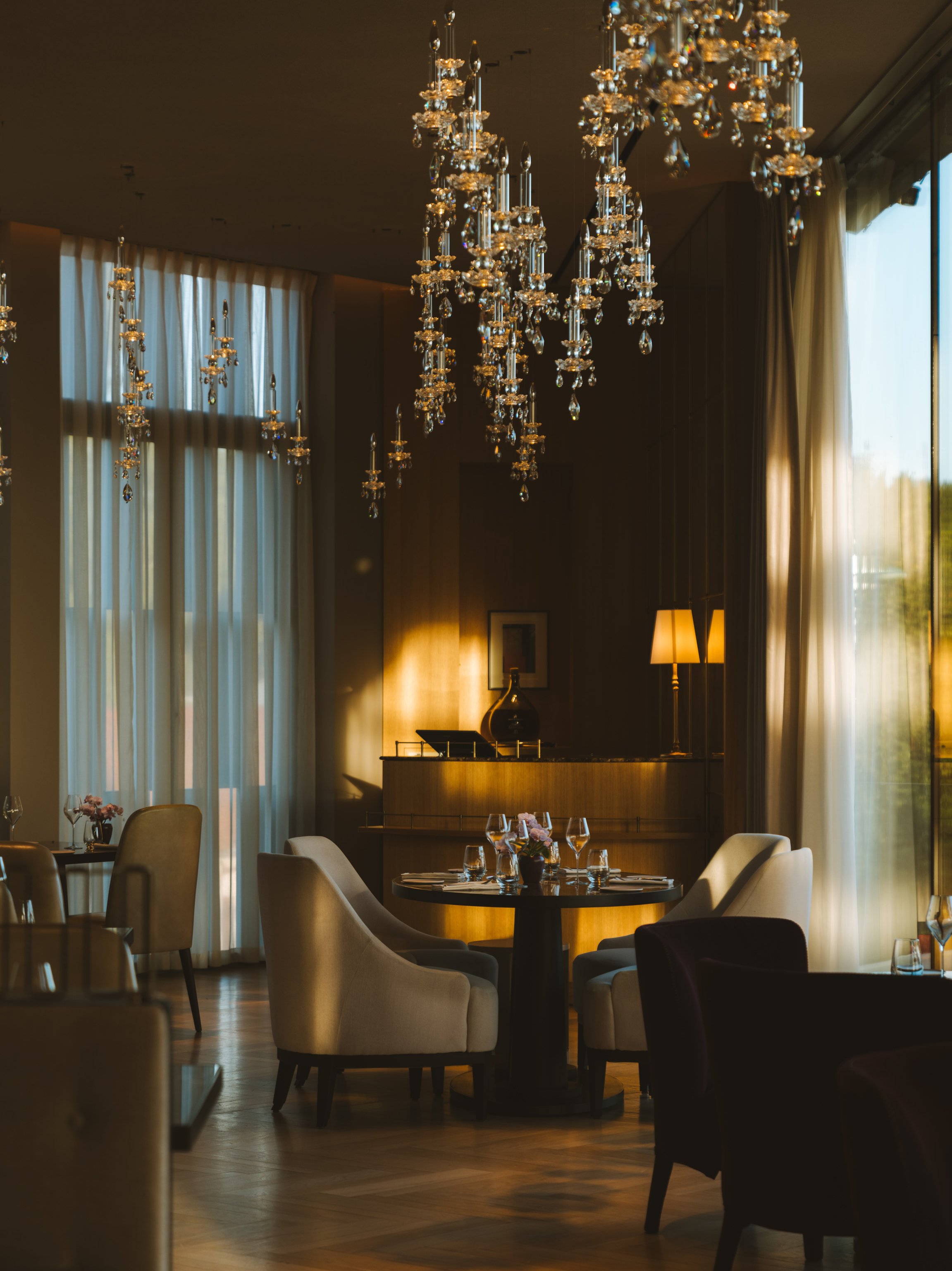 Elegant chandelier-lit dining room at Royal Champagne Hotel + Spa